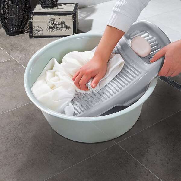 A compact mini washboard for clothes with a corrugated surface and integrated soap holder.