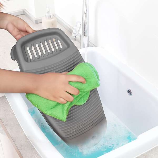 A compact mini washboard for clothes with a corrugated surface and integrated soap holder.