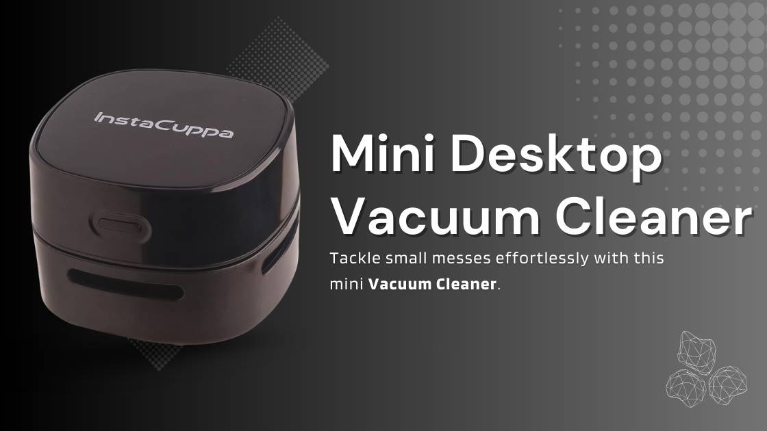 InstaCuppa Mini Portable Desktop Vacuum Cleaner in use, cleaning a desktop.