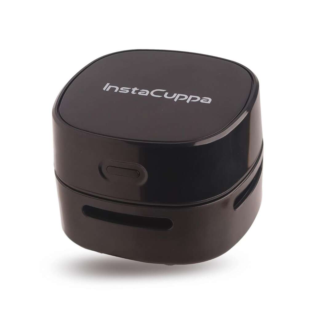 InstaCuppa Mini Portable Desktop Vacuum Cleaner 12 InstaCuppa Mini Portable Desktop Vacuum Cleaner in use, cleaning a desktop.